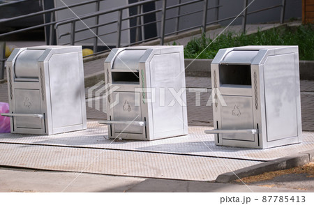 Stainless steel garbage cans for separate disposal of recycle trash on city street 87785413