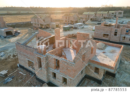 Industrial building site in rural area with residential houses under construction for future sale or leasing. Concept of real estate development 87785553