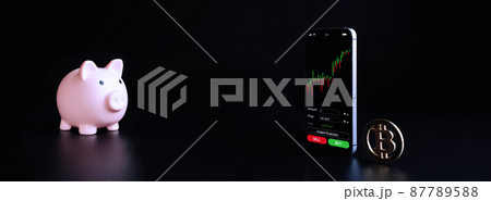 Exchange bitcoin. Gold crypto currency BTC bitcoin, pink pig bank on black background. Crypto currency exchange mobile phone app. Virtual online business concept. Exchange bitcoin. Gold crypto currency BTC bitcoin, pink pig bank on black background. Crypto currency exchange mobile phone app. Virtual online business concept. 87789588