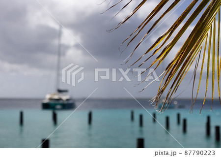 Sailboat on azure sea in stormy weather. Selective focus. Sailboat on azure sea in stormy weather. Selective focus. 87790223