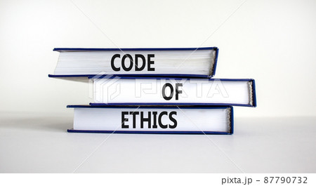 Code of ethics symbol. Books with words 'code of ethics' on beautiful white table, white background. Business and code of ethics concept. Copy space. Code of ethics symbol. Books with words 'code of ethics' on beautiful white table, white background. Business and code of ethics concept. Copy space. 87790732