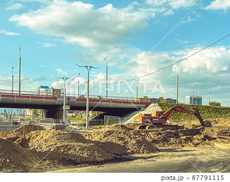construction of a new area of the city. construction ditch, laying of cables and underground communications. construction of a new overpass in a large microdistrict construction of a new area of the city. construction ditch, laying of cables and underground communications. construction of a new overpass in a large microdistrict 87791115