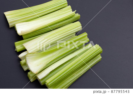 Fresh celery on dark background. Fresh celery on dark background. 87795543