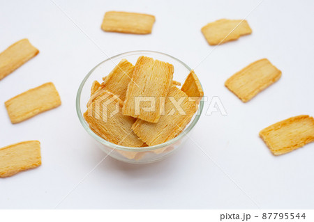 Cheese crispies on white background. Cheese crispies on white background. 87795544