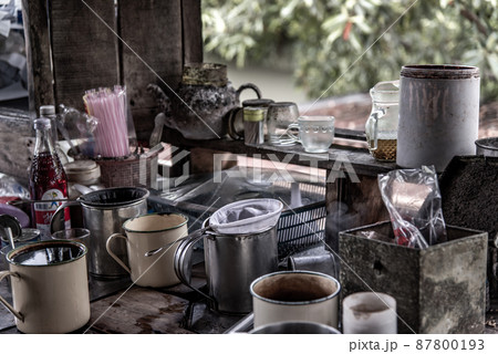 local cafe -decorated with vintage wooden furniture and antique goods, Making a traditional Thai Coffee and Tea on counter for sale at street food market, vintage style 87800193