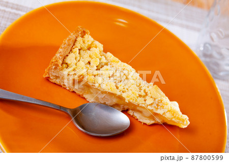 One piece of just prepared apple pie on plate One piece of just prepared apple pie on plate 87800599