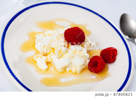 Catalan dessert - fresh cheese Mato with honey and strawberry 87800825