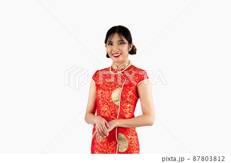 Asian woman in red traditional oriental costume isolated on white background. Chinese new year concept style.. 87803812