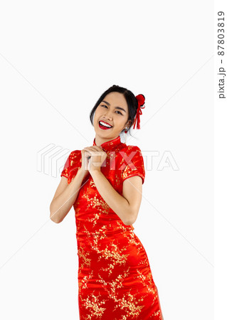 Chinese new year woman concept, happy asian woman wearing red Cheongsam dress isolated on white background. 87803819