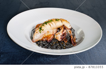 Grilled squid with black rice Grilled squid with black rice 87813355