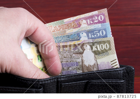 Zambian money in the black wallet 87813725
