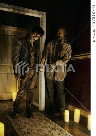 Zombie house with candlelight and scary corpse 87813741