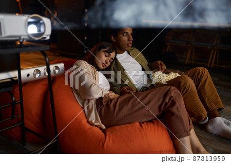 Family watching movie enjoy relax home time 87813959