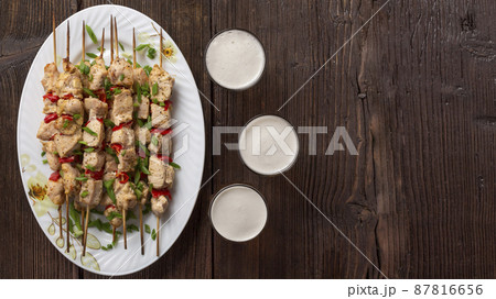 Barbecue with barbecue and beer outdoors 87816656
