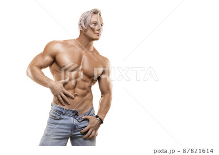 Strong healthy athletic man in jeans isolated on white. Strong healthy athletic man in jeans isolated on white. 87821614