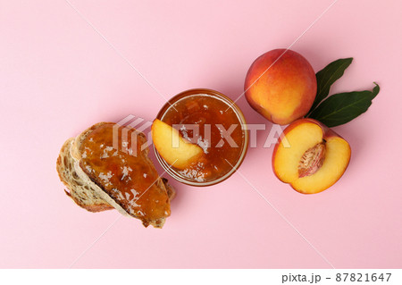 Sandwich with peach jam and ingredients on pink background Sandwich with peach jam and ingredients on pink background 87821647