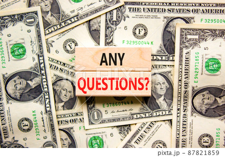 Any questions symbol. Concept words Any questions on wooden blocks on a beautiful background from dollar bills. Business and Any questions Q and A concept, copy space. Any questions symbol. Concept words Any questions on wooden blocks on a beautiful background from dollar bills. Business and Any questions Q and A concept, copy space. 87821859