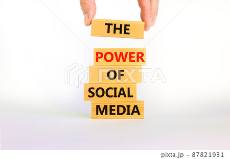 Power of social media symbol. Wooden blocks with words The power of social media. Beautiful white background, copy space. Businessman hand. Business, power of social media concept. 87821931