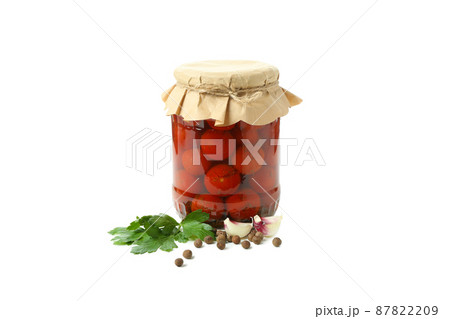 Jar of pickled tomatoes and ingredients isolated on white background 87822209