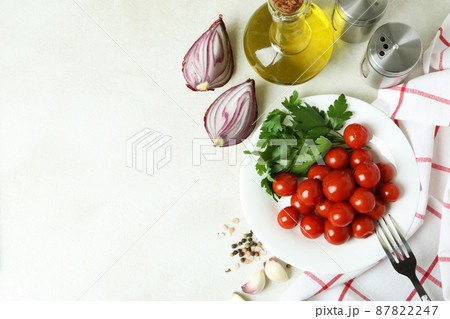 Concept of pickled vegetables with tomatoes on white textured table 87822247