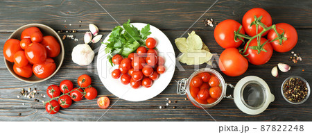 Concept of pickled vegetables with tomatoes on rustic wooden table Concept of pickled vegetables with tomatoes on rustic wooden table 87822248