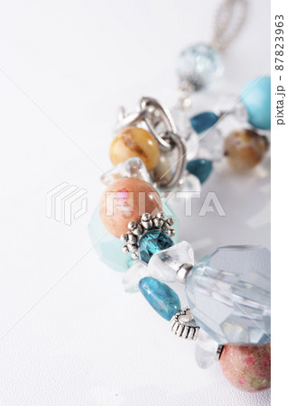jewerly bracelet with semiprecious stones around white background. top view. macro shot jewerly bracelet with semiprecious stones around white background. top view. macro shot 87823963