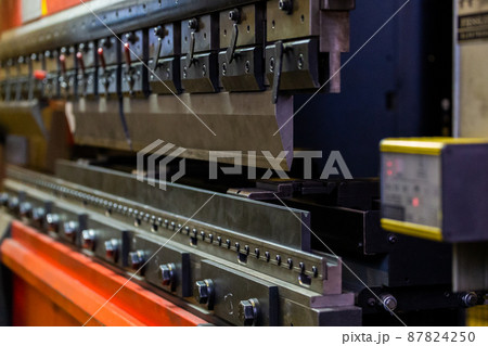 closeup view of industrial sheet bending press brake with tool 87824250