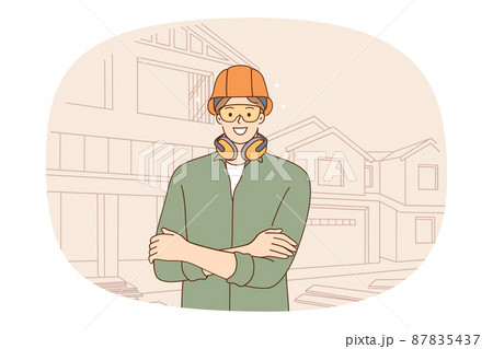 Smiling male constructor in protective gear at building site Smiling male constructor in protective gear at building site 87835437
