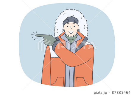 Smiling man in outerwear point direction Smiling man in outerwear point direction 87835464