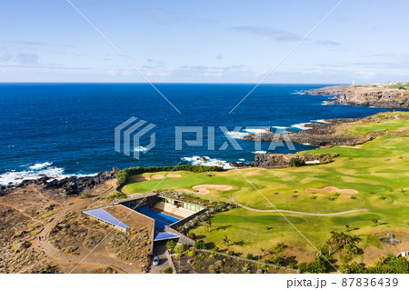 Golf course near the Atlantic ocean in Tenerife, Spain, green Golf course, tennis court in the nature of Tenerife Golf course near the Atlantic ocean in Tenerife, Spain, green Golf course, tennis court in the nature of Tenerife 87836439