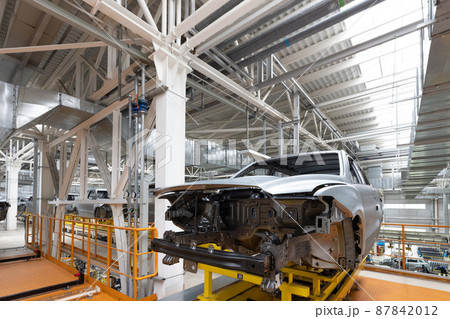 Car bodies are on assembly line. Factory for production of cars. Modern automotive industry. A car Car bodies are on assembly line. Factory for production of cars. Modern automotive industry. A car 87842012
