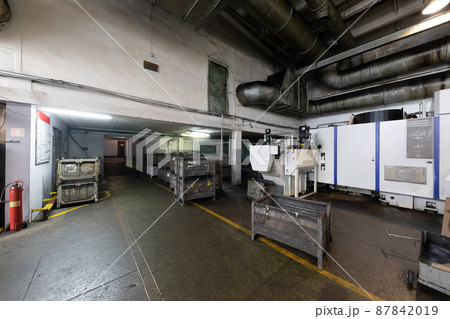 Photo of modern automobile manufacturing workshop. Factory with steel constructions. Plant concept Photo of modern automobile manufacturing workshop. Factory with steel constructions. Plant concept 87842019