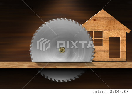 Small Wooden Model House and Metal Circular Saw Blade in Motion Small Wooden Model House and Metal Circular Saw Blade in Motion 87842203