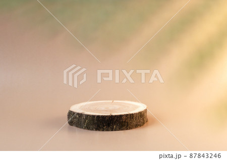Wooden tray podium for cosmetics. Front view. Luxury and natural autumn cosmetics presentation. Woodcut for perfume. Front view. Soft focus Wooden tray podium for cosmetics. Front view. Luxury and natural autumn cosmetics presentation. Woodcut for perfume. Front view. Soft focus 87843246