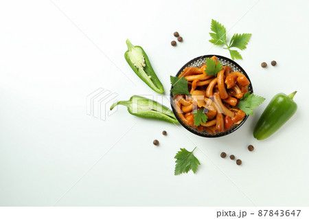 Bowl of marinated mushrooms on white background 87843647