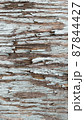 Close-up background with cracked blue paint texture on gray wood 87844427