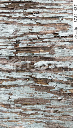 Close-up background with cracked blue paint texture on gray wood 87844427