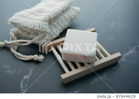 Homemade natural soap bar on black background Homemade natural soap bar on black background 87844629