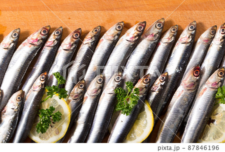 Anchovies served on wooden surface Anchovies served on wooden surface 87846196