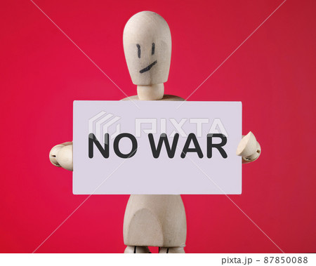 No War the inscription on the card is in the hands of a wooden man No War the inscription on the card is in the hands of a wooden man 87850088