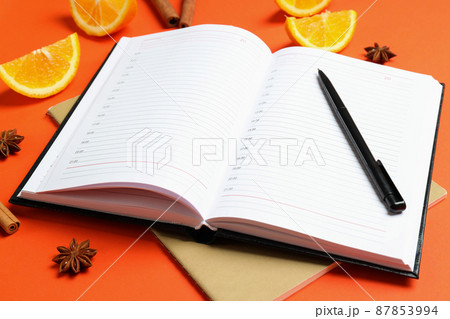 Concept of recipe book on orange background, space for text 87853994