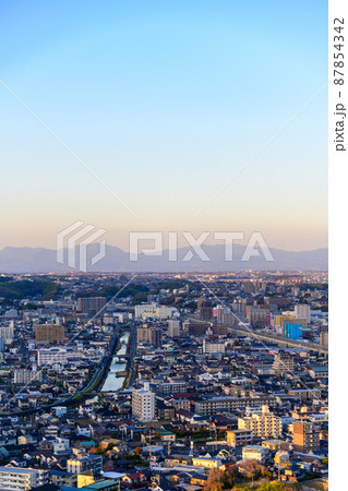 上熊本駅周辺パノラマ風景(夕日の光芒景色) 87854342