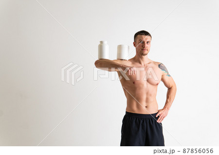 Fitness protein jars white on white background bodybuilder powder strong high ache background human chronic. Hold neck disease suffer attractive Fitness protein jars white on white background bodybuilder powder strong high ache background human chronic. Hold neck disease suffer attractive 87856056