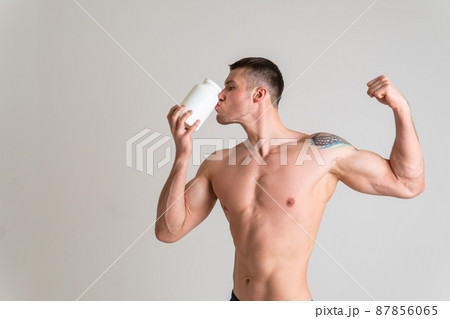 Fitness protein jars white on white background bodybuilder powder strong high body painful, backache sick male background medicine, illness Touching neck sickness, disease suffer attractive Fitness protein jars white on white background bodybuilder powder strong high body painful, backache sick male background medicine, illness Touching neck sickness, disease suffer attractive 87856065