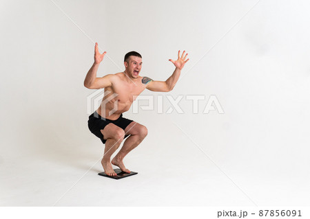 Man with weights health pondered, health and sports on a white background muscle, man medicine, human chronic. lumbar sickness, problem suffer attractive Man with weights health pondered, health and sports on a white background muscle, man medicine, human chronic. lumbar sickness, problem suffer attractive 87856091