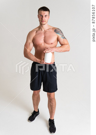 Fitness protein jars white on white background bodybuilder powder strong high pain hurt painful, person white background stress, hand Touching care, lower suffer attractive 87856107
