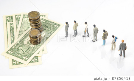 miniature people. different businessman stands near dollar money. investments and earnings for work miniature people. different businessman stands near dollar money. investments and earnings for work 87856413