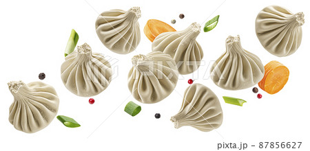 Falling khinkali, frozen dumplings isolated on white background Falling khinkali, frozen dumplings isolated on white background 87856627