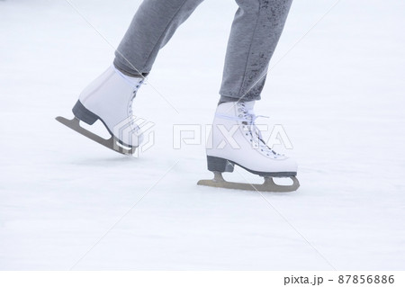ice skating woman legs on ice rink. hobbies and winter sports ice skating woman legs on ice rink. hobbies and winter sports 87856886