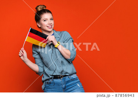 woman hold small German flag 87856943